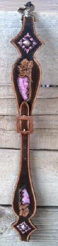 Hand tooled whither strap.