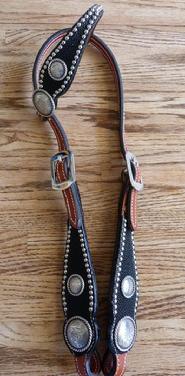Chestnut oil single ear headstall w/ Black Stingray overlay, silver dots, and Antique Silver Rope edged hardware. Classic eye catcher!