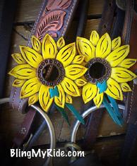 Hand tooled and painted sunflower bit guards with turquoise ties.
