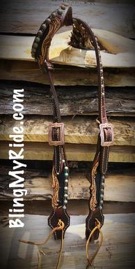 Hand tooled S/E headstall with scroll cutouts, patina parachute spots and ties at the bit ends.