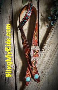 Hand tooled and painted sunflower belt style headstall with buckstitched earpiece and turquoise silver pinwheel conchos.