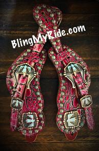 Fuchsia gator overlay spur straps, with patina spots and turquoise thunderbird hardware.