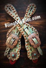 Seafoam turquoise. and brown spur straps with antique copper and turquoise hardware.
