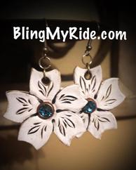 Hand tooled leather floral earrings with blue topaz Swarovski center stone.