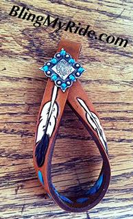 Hand tooled and painted, feathered  tie down keeper.