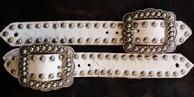Belt style spur straps. White hair on w/ Ant. silver fancy spots and buckles.