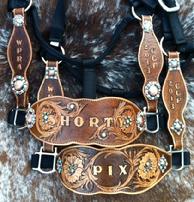 Hand tooled award halters.