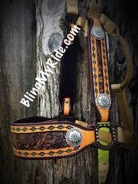 Average size Mustang halter, Hand stamped aztec design with brown floral inlays. Silver and turquoise ponchos. Bling bronc style halter.