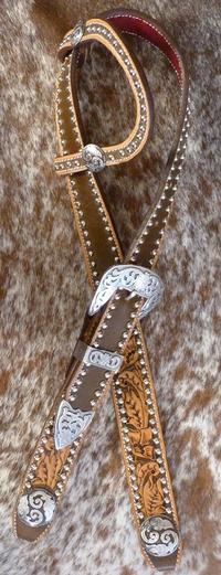 Hand tooled and dyed belt style headstall w/ single ear, scroll conchos and three piece buckles.