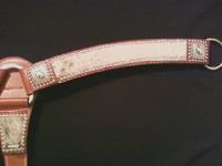 2" Chestnut Breast Collar, Light brindle hair-on-hide, silver spots and Antique Silver Bronc hardware backed by rosettes.