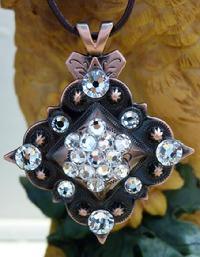 Bling Concho Necklace.Square Bronze concho w/ Clear Crystal Swarovskis on an 18" brown cord necklace.