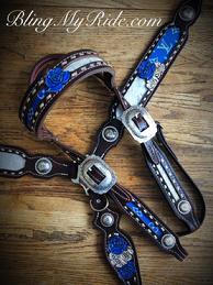 Beautiful royal blue Louise Vuitton and silver acid wash hair on inlay custom tack set with hand tooled and painted roses with Browband headstall, metallic silver buckstitch finished off with chocolate leather and antique silver hardware.