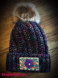 Multi color CC Beanie with hand tooled and painted purple flower patch with turquoise buckstitch.