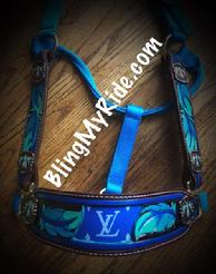 Hand tooled and painted feather bling halter with royal blue LV inlays and thunderbird hardware.