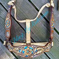 Hand tooled, inlaid and buckstitched bronc style halter.