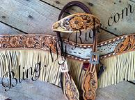 Hand tooled, buckstitched and inlaid tack set with browband and tripping collar. Floral and feather design.