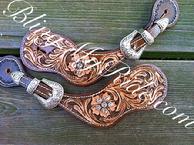 Hand tooled spur straps with Clear Swarovskis.