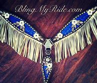 Hand tooled and croc. inlaid breastcollar with fringe.