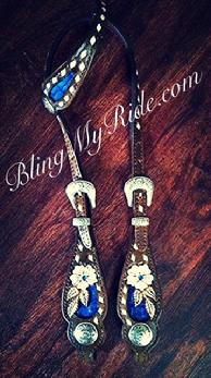 Hand tooled floral single ear headstall with royal blue croc. inlays and antique silver buckles and conchos.