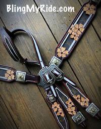 Floral hand tooled genuine LV inlaid single ear tack set. Upgraded buckles and conchos, white painted piping. GORGEOUS.