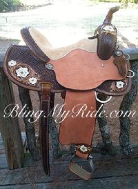 Hand tooled and painted barrel saddle with round skirt.